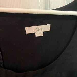 Scalloped shorts romper with open back. Black.